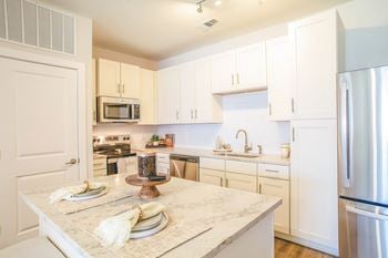 Quartz countertops in all kitchens and baths